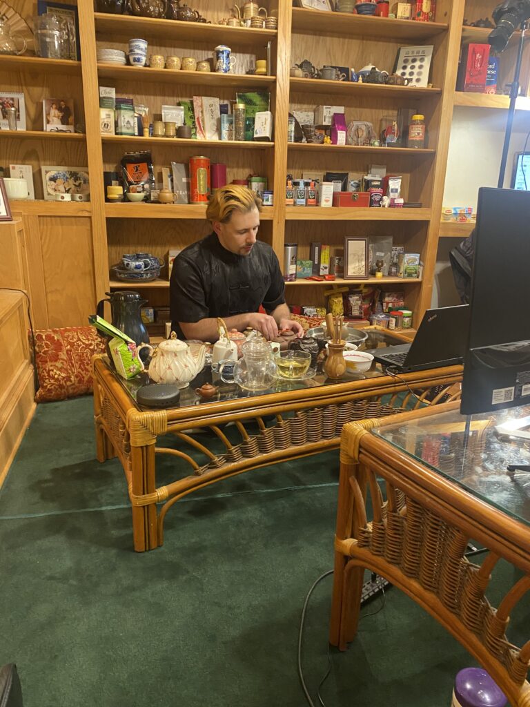 Tyler Pruitt performs a tea demonstration virtually over zoom with cameras and equipment to give participants a great view. The location is Tyler's personal tea room.